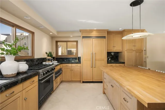 a kitchen with a sink stove and refrigerator