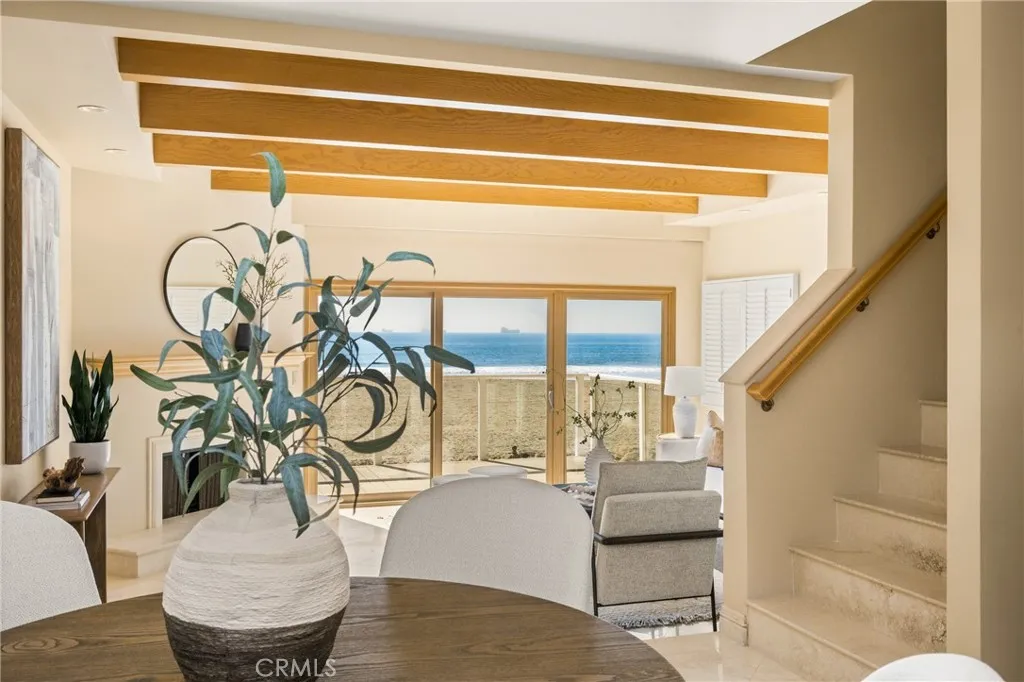 78 Surfside Avenue Surfside, CA 90743 - Photo 22 of 45 a living room with furniture and a potted plant