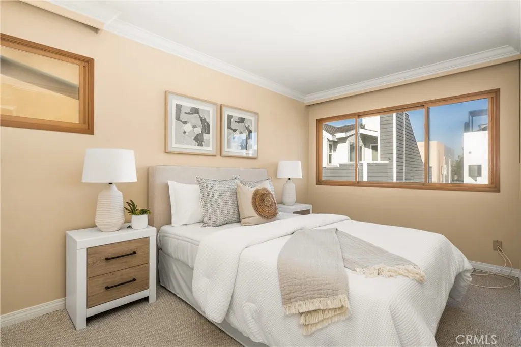 78 Surfside Avenue Surfside, CA 90743 - Photo 30 of 45 a bedroom with a bed and a window