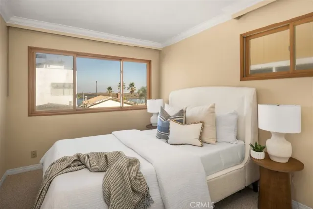 a bedroom with a bed and window