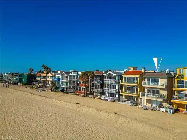 a view of a street with a building and trees in the background