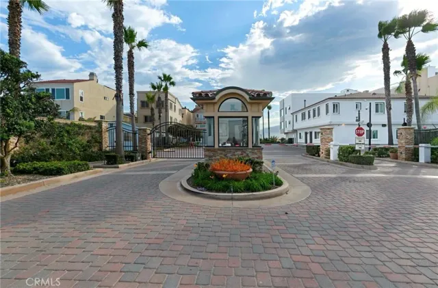 a street sign on a wall next to a road