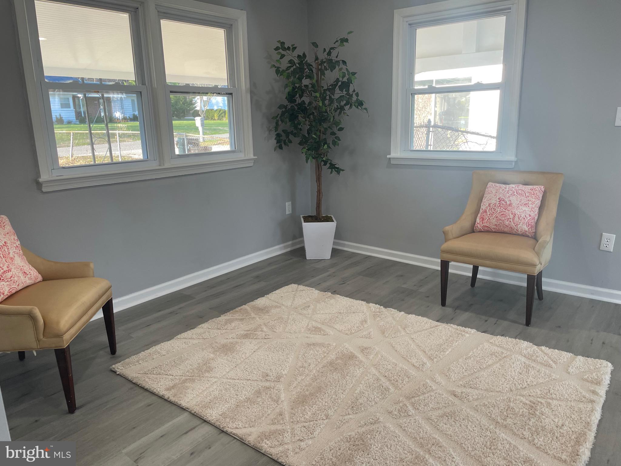 6107 Buckler Road Clinton, MD 20735 - Photo 11 of 45 a bedroom with a bed and a chair