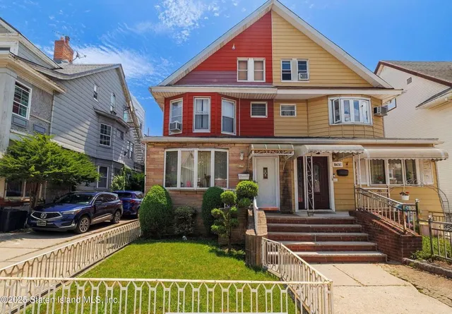 a view of a house with roof deck