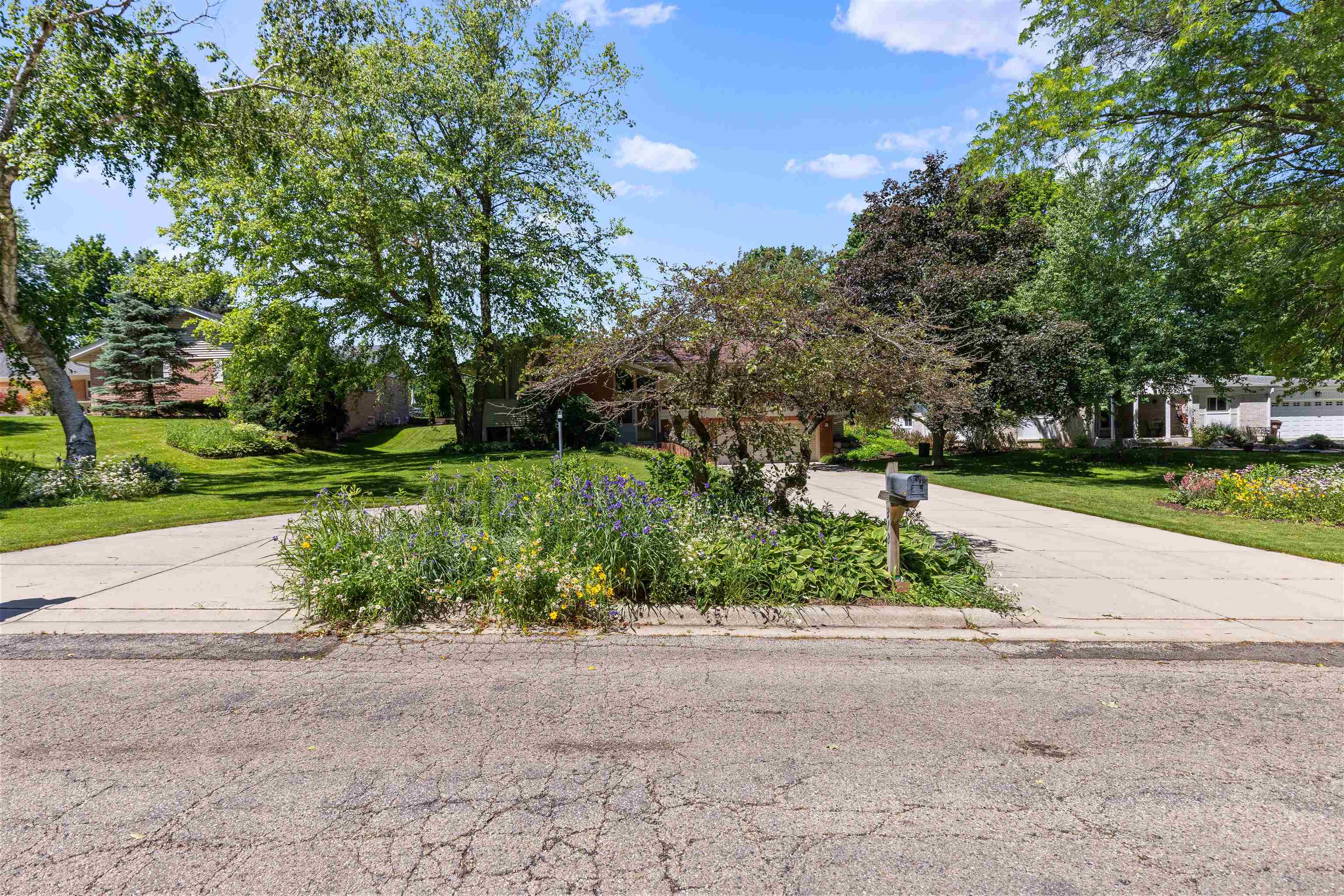 818 Roxbury Road Rockford, IL 61107 - Photo 6 of 29 a front view of a house with a yard and a garage