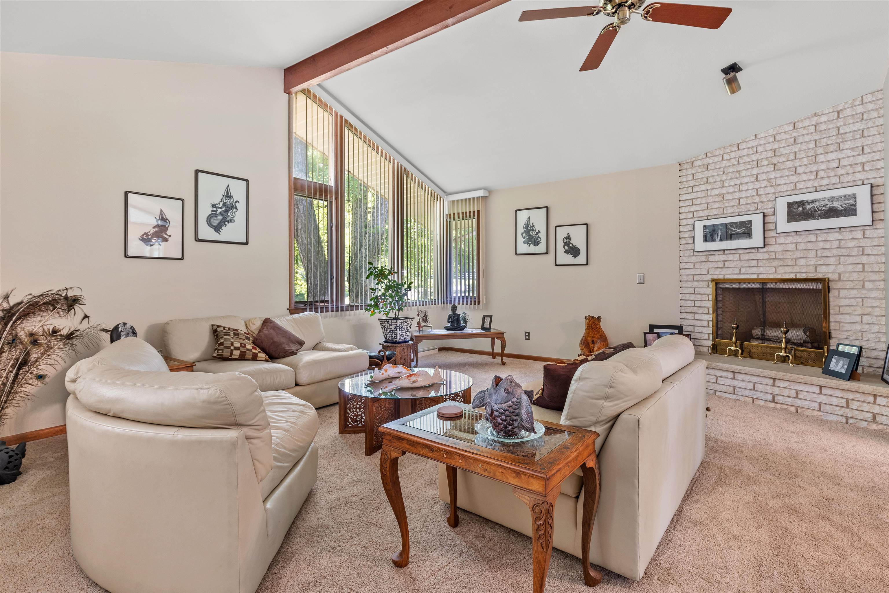 818 Roxbury Road Rockford, IL 61107 - Photo 7 of 29 a living room with furniture a large window and a fireplace