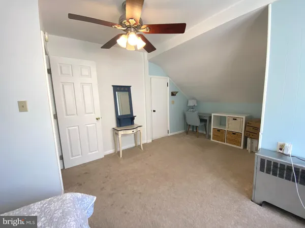 a view of livingroom with hardwood floor and a ceiling fan