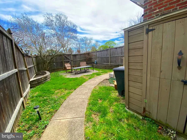 a view of backyard with a garden and entertaining space