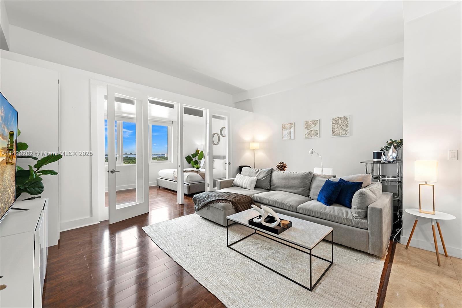 Mid Beach Miami Beach, FL 33139 - Photo 1 of 30 a living room with furniture rug and wooden floor