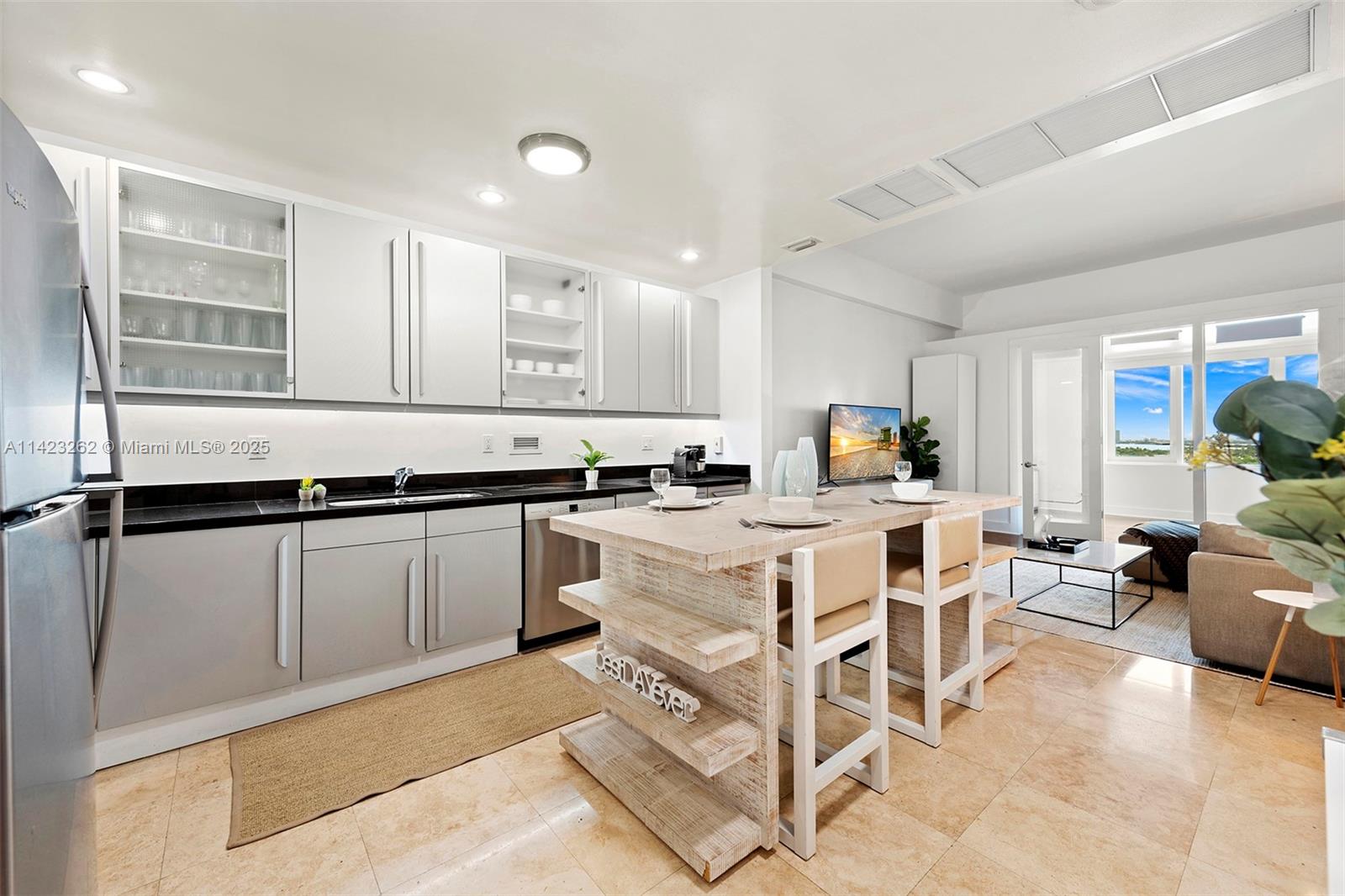 Mid Beach Miami Beach, FL 33139 - Photo 23 of 30 a living room with furniture and kitchen
