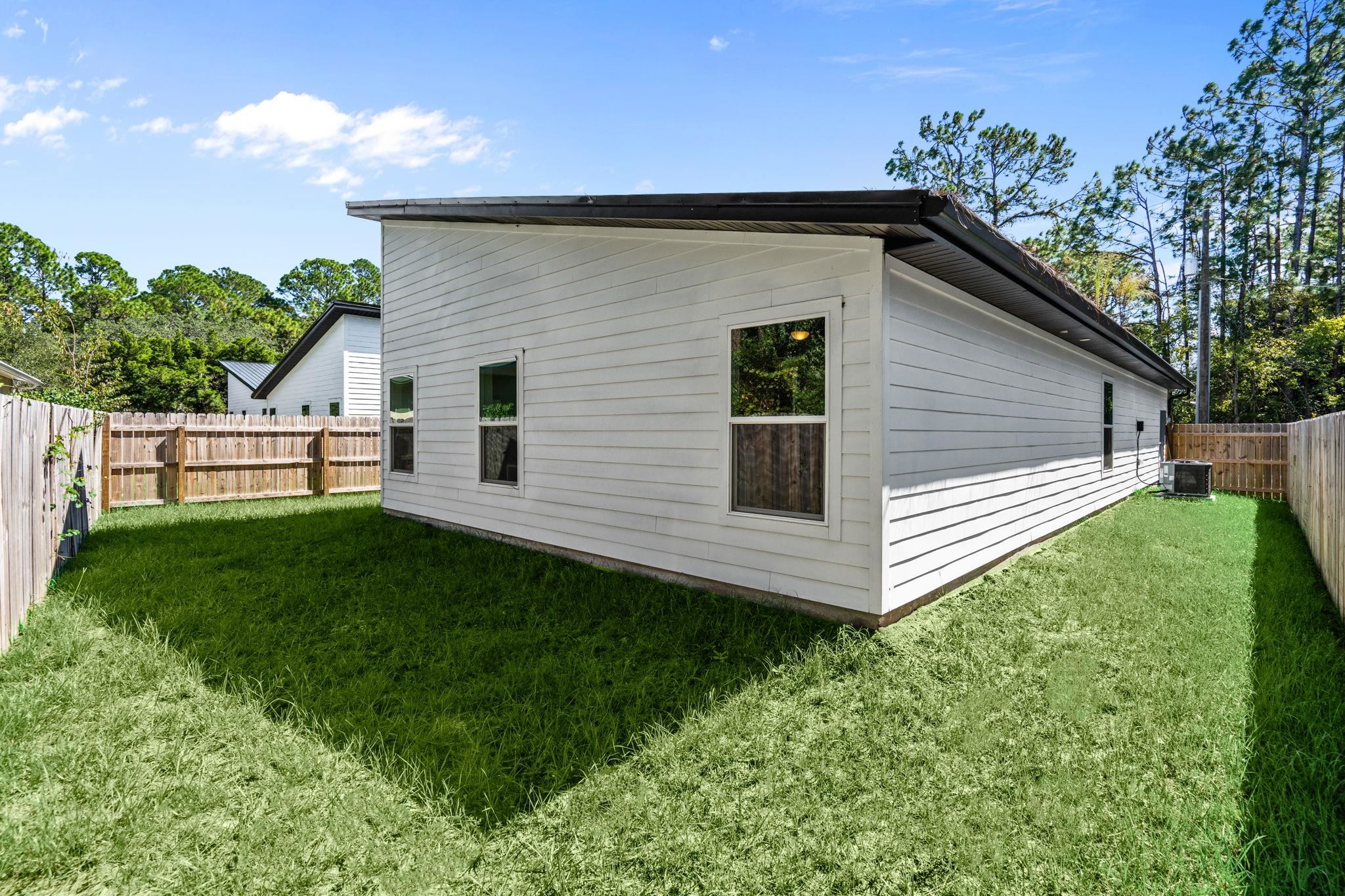 804 West 9th Street St. Augustine, FL 32084 - Photo 28 of 31 View of property exterior featuring a fenced backyard and a central air condition unit