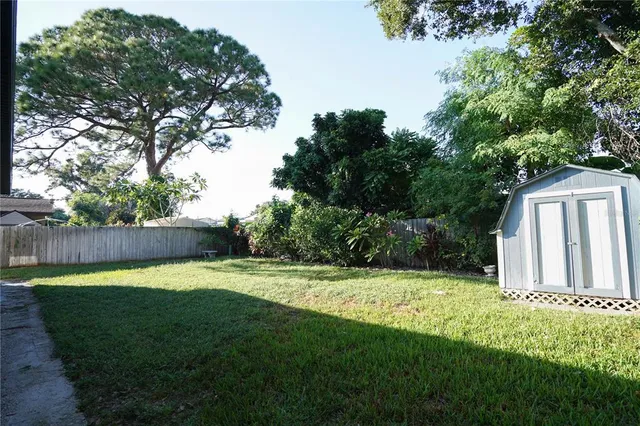 a backyard of a house with lots of green space