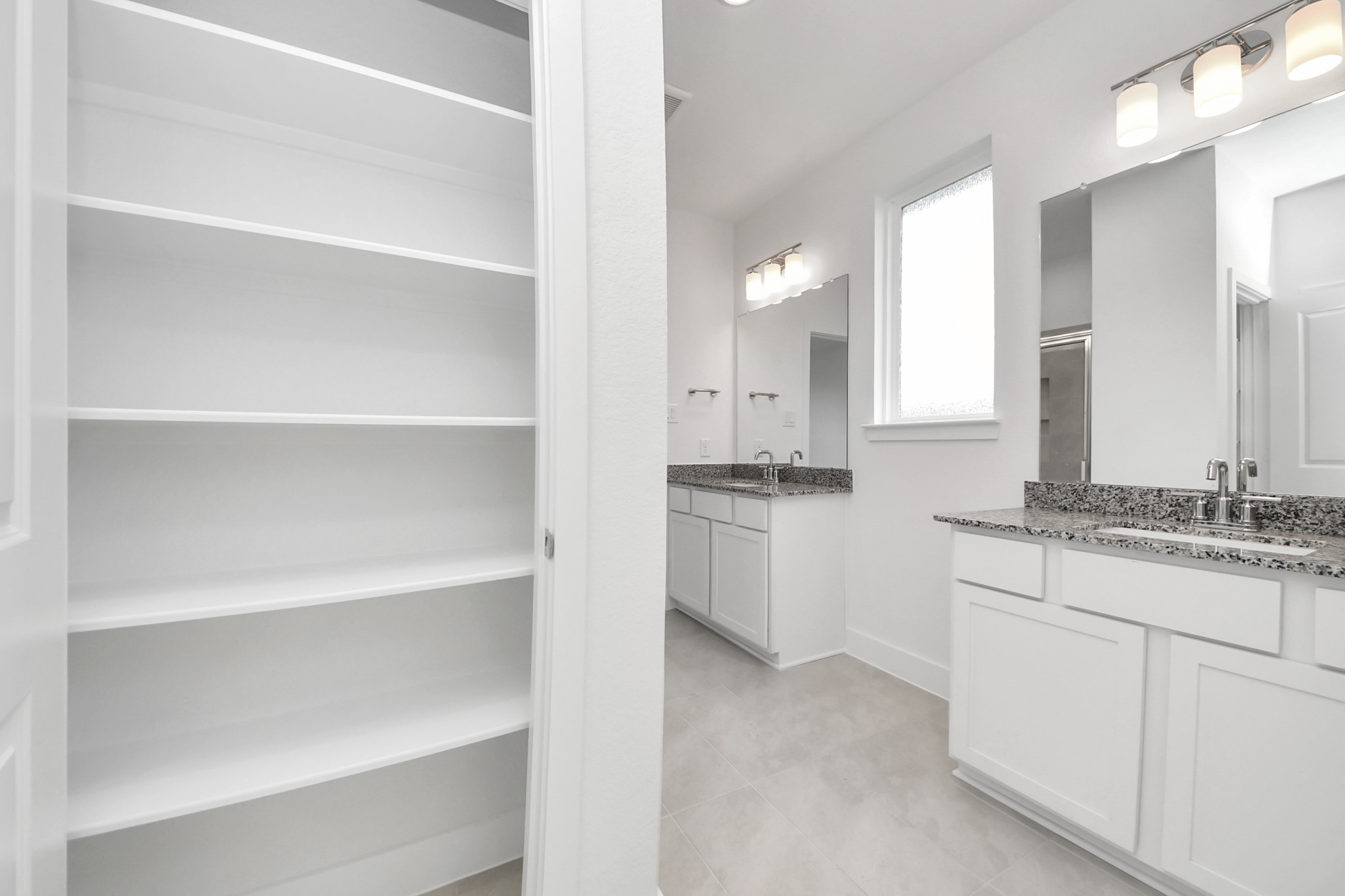 14439 Trumpet Lane Splendora, TX 77372 - Photo 18 of 37 a bathroom with a granite countertop sink and a mirror
