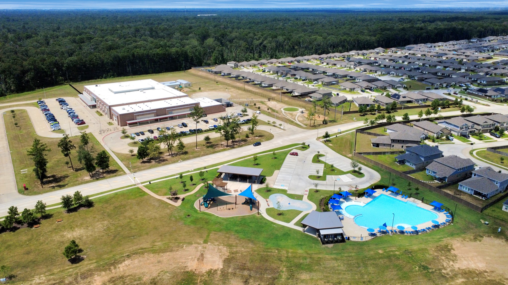 14439 Trumpet Lane Splendora, TX 77372 - Photo 33 of 37 an aerial view of a house with a garden and lake view