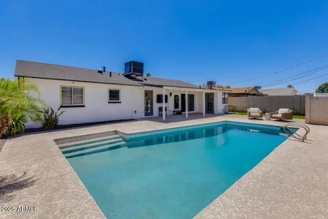 a view of a house with a swimming pool