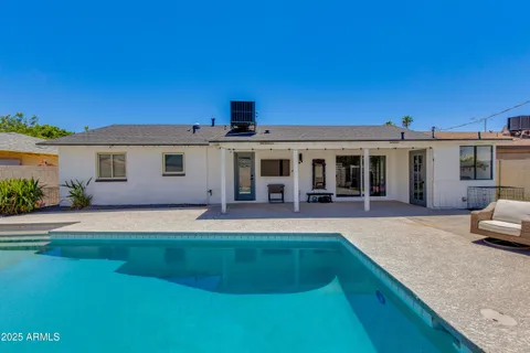 a front view of a house with a yard and porch