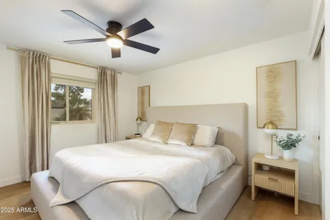 a bedroom with bed and window