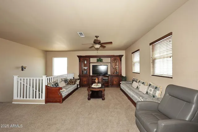 a bedroom with furniture and a window