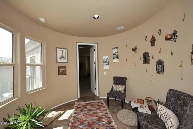 a bedroom with furniture and window