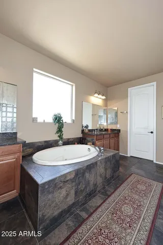 a bathroom with a sink a toilet and shower curtain