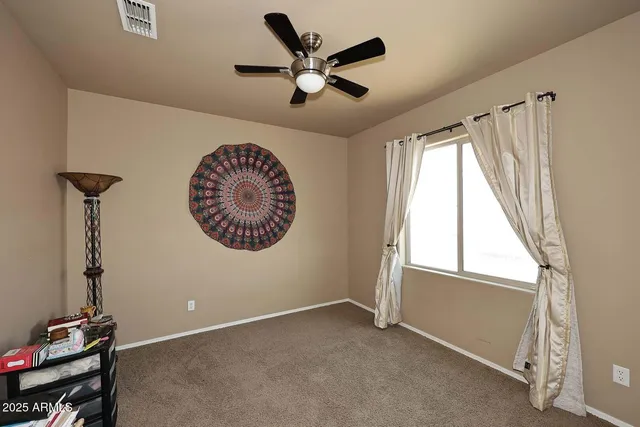 a bedroom with furniture and a window