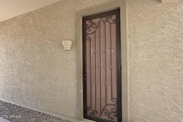 a pathway of a house with a yard