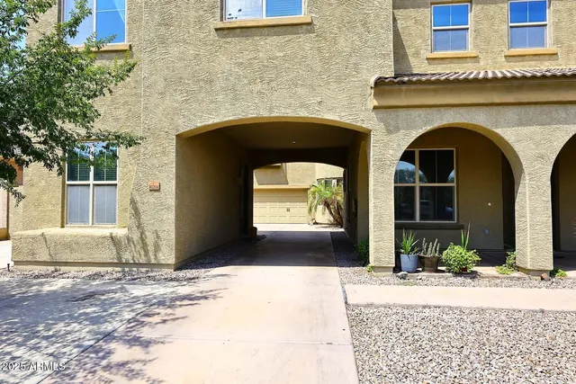 a swimming pool with outdoor seating and a patio