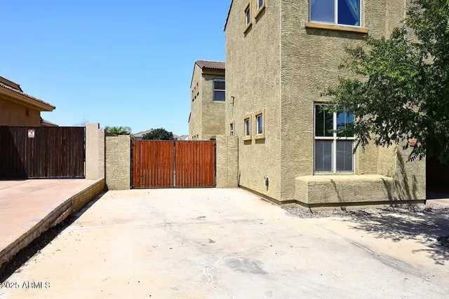an aerial view of a house with a garden and plants