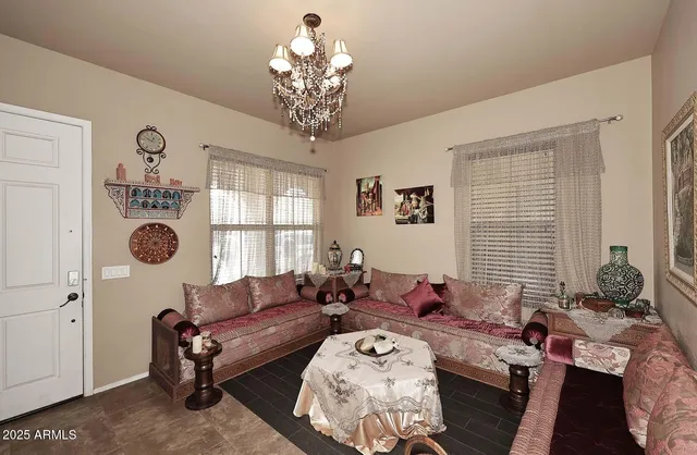 a kitchen with granite countertop a refrigerator stove and microwave