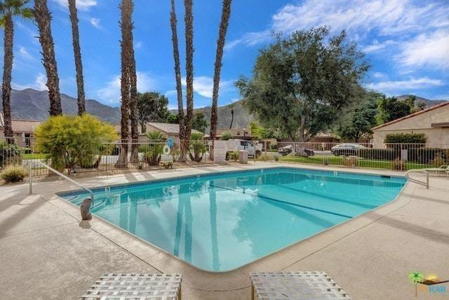 11 Palma Drive Rancho Mirage, CA 92270 - Photo 22 of 44 a view of a swimming pool with a patio