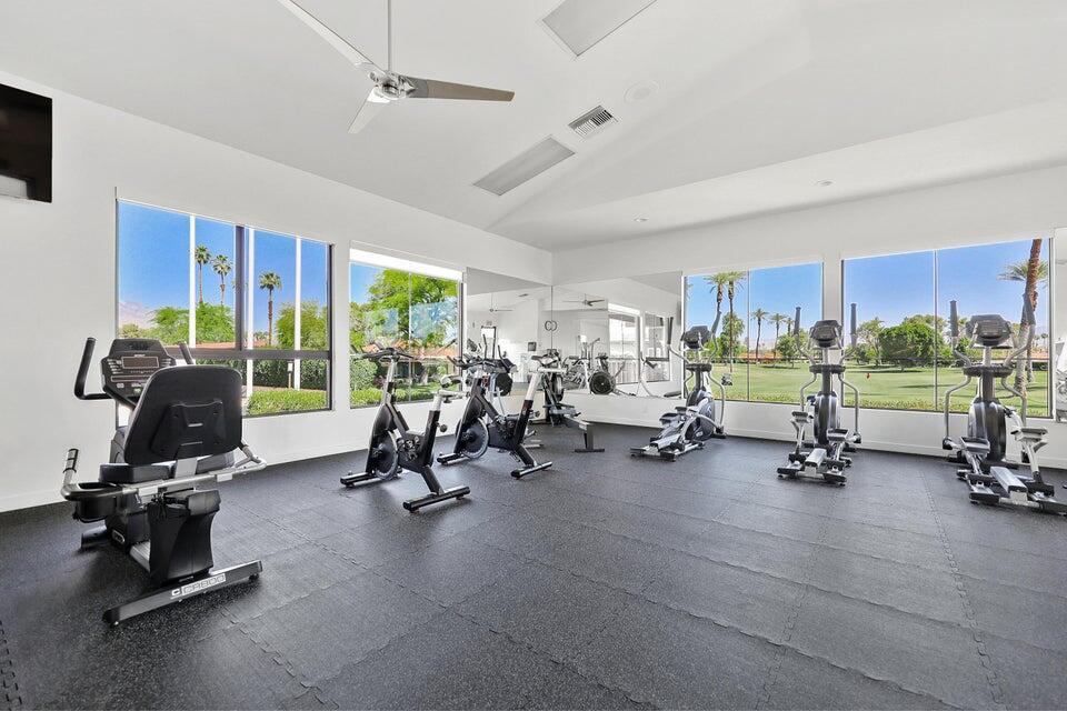 11 Palma Drive Rancho Mirage, CA 92270 - Photo 34 of 44 a view of a room with gym equipment and floor to ceiling window