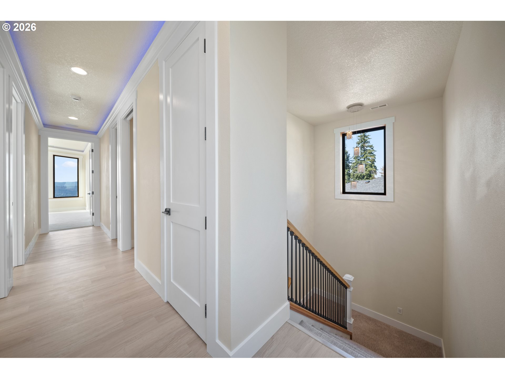 120 Victoria Circle Kalama, WA 98625 - Photo 18 of 44 a hallway with wooden floor and windows