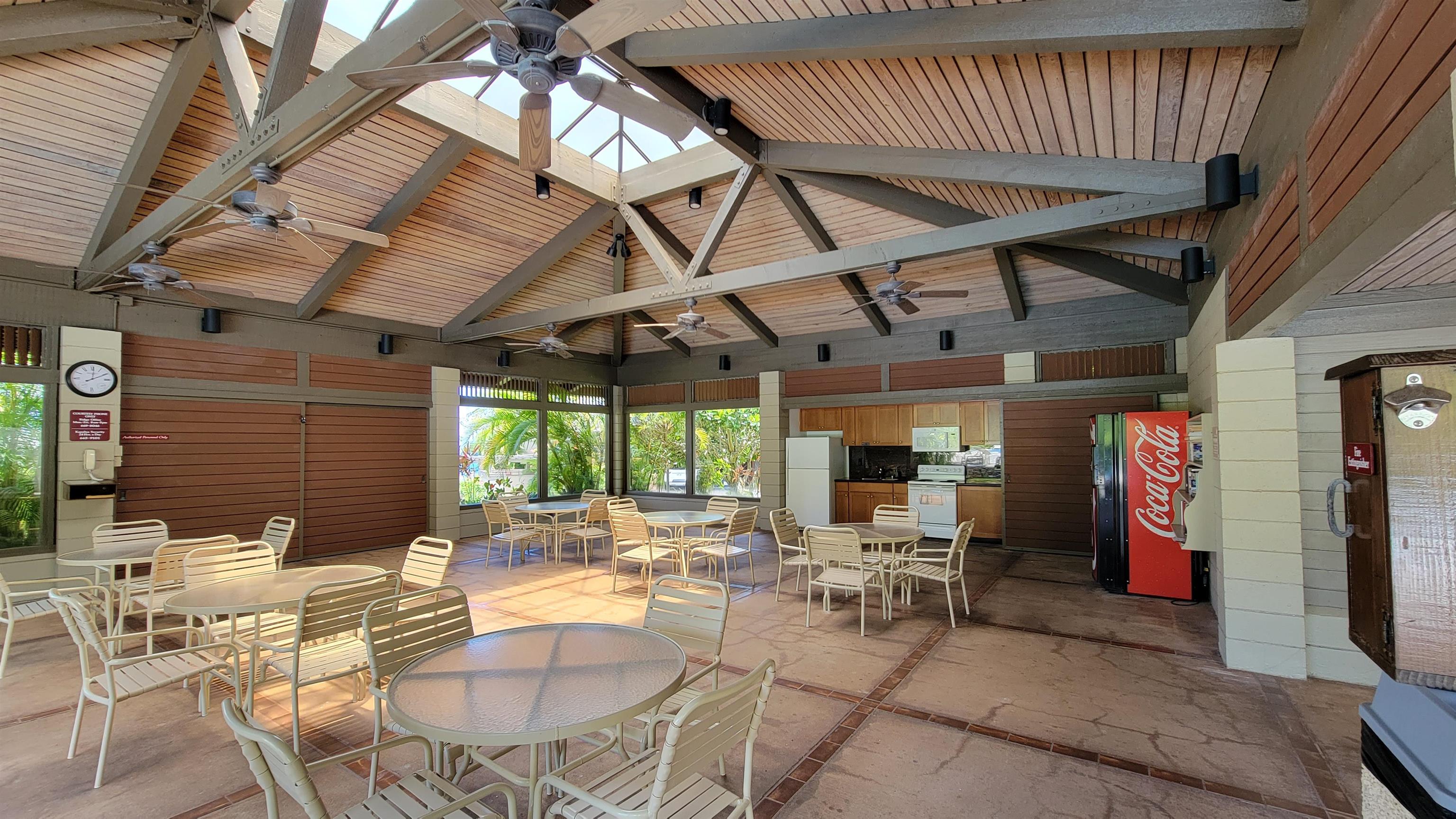 100 Ridge Road, Unit 724 Lahaina, HI 96761 - Photo 24 of 27 a view of a patio with table and chairs and potted plants