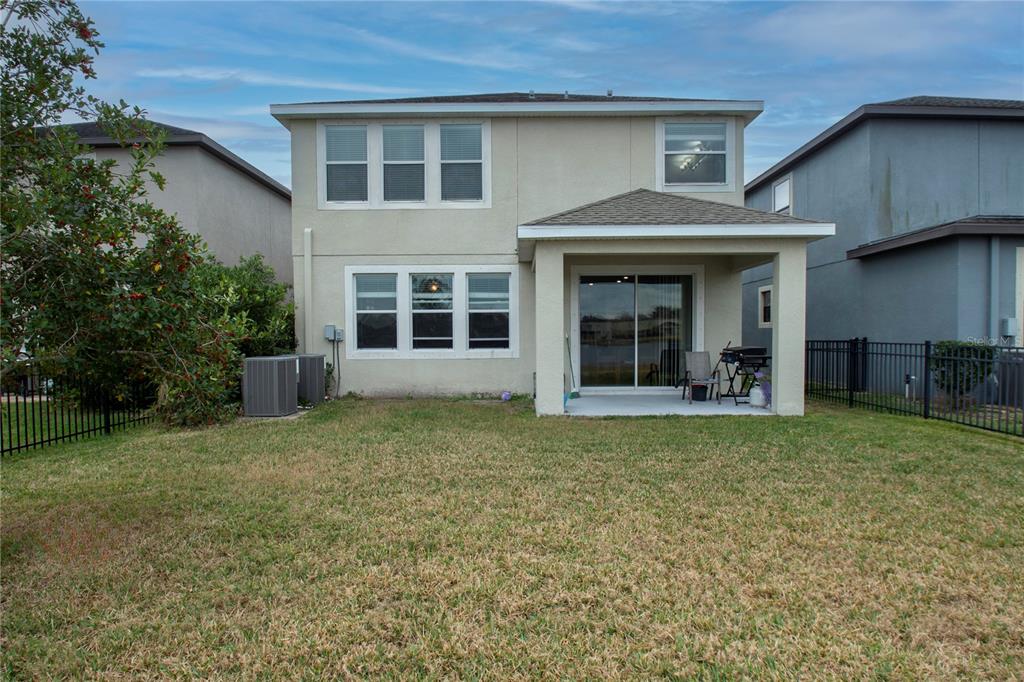 10158 Newminster Loop Ruskin, FL 33573 - Photo 12 of 12 a view of a house with a garden