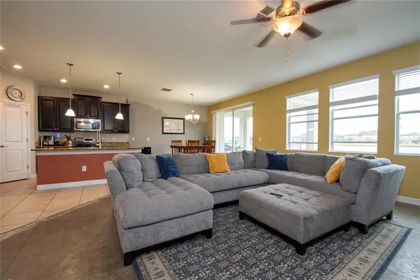 a living room with furniture and a large window