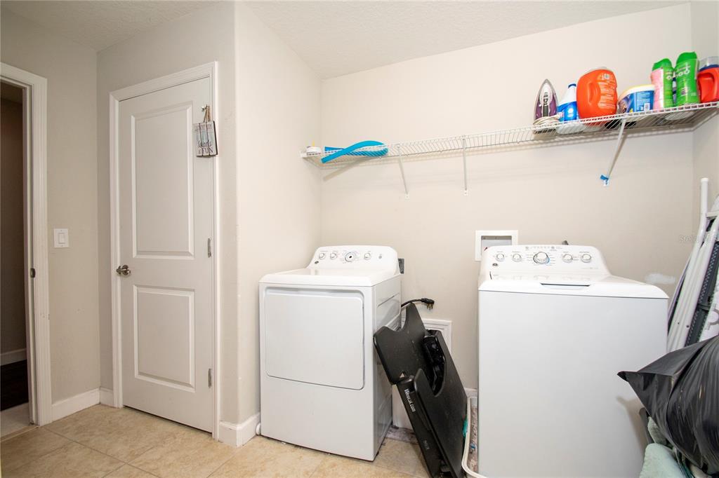10158 Newminster Loop Ruskin, FL 33573 - Photo 9 of 12 a utility room with dryer and washer