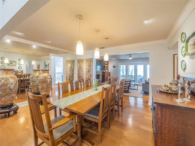 a living room with fireplace furniture and a large window