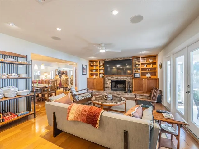 a living room with fireplace furniture and a fireplace