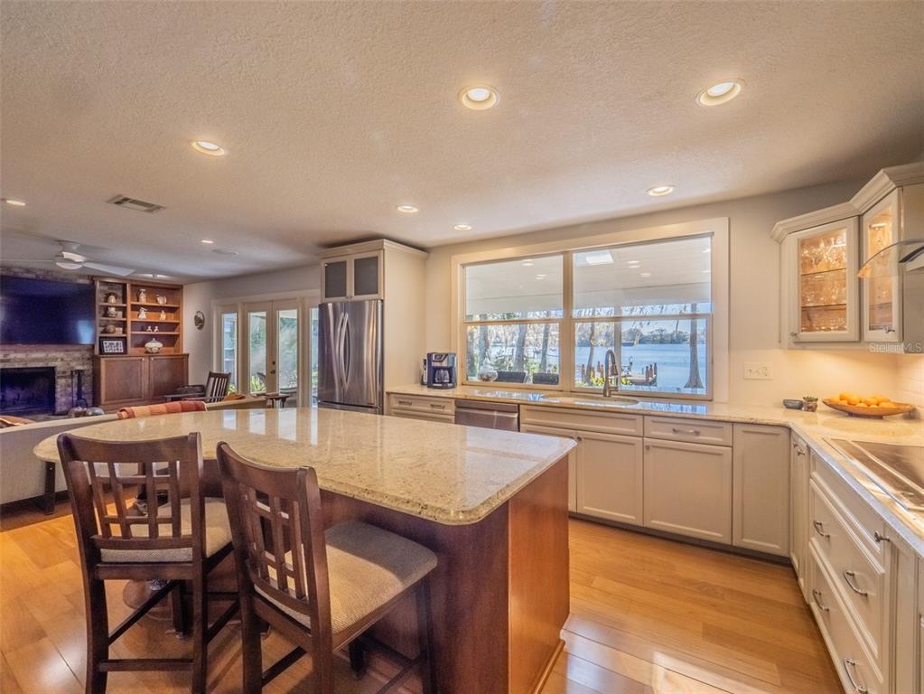 1444 Pelican Bay Trail Winter Park, FL 32792 - Photo 22 of 57 a large kitchen with granite countertop lots of counter space and windows