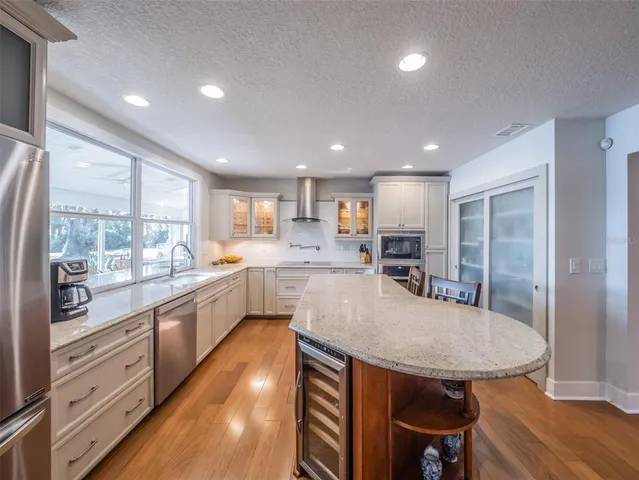 a spacious bedroom with a large bed and a couch