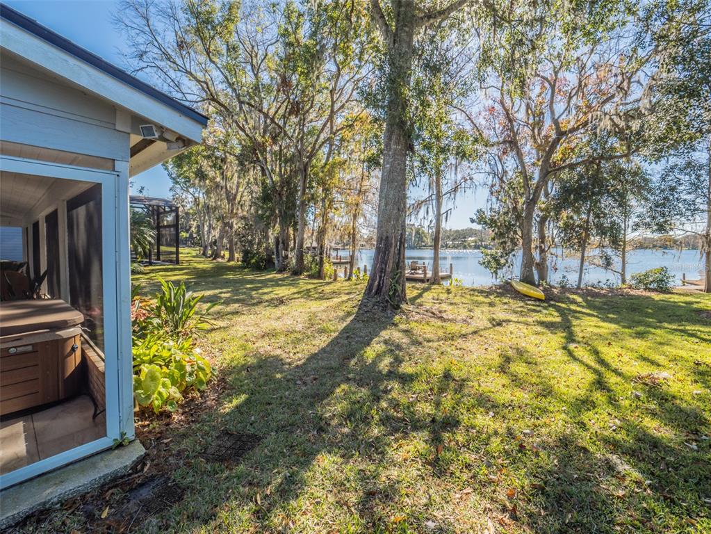 1444 Pelican Bay Trail Winter Park, FL 32792 - Photo 49 of 57 a view of a yard with wooden fence