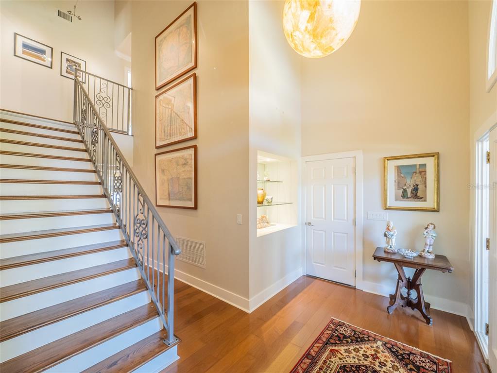 1444 Pelican Bay Trail Winter Park, FL 32792 - Photo 7 of 57 a view of a livingroom with wooden floor and a workspace