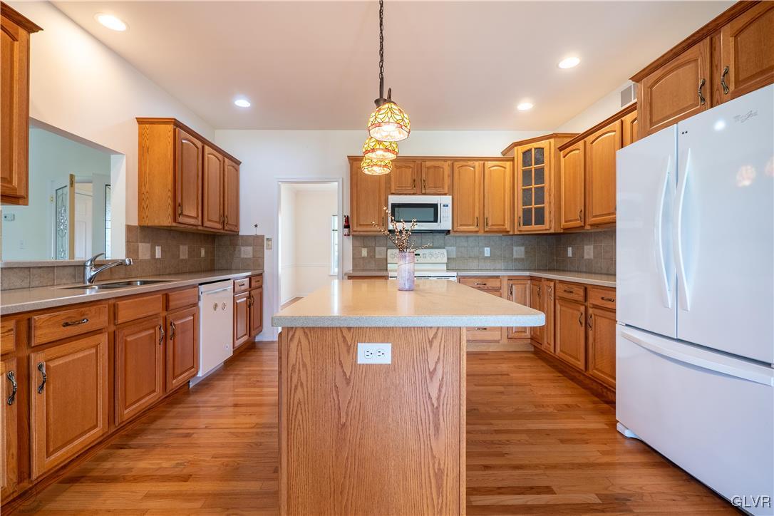 212 Bushkill Ridge Road Wind Gap, PA 18091 - Photo 12 of 36 a large kitchen with stainless steel appliances and wooden cabinets
