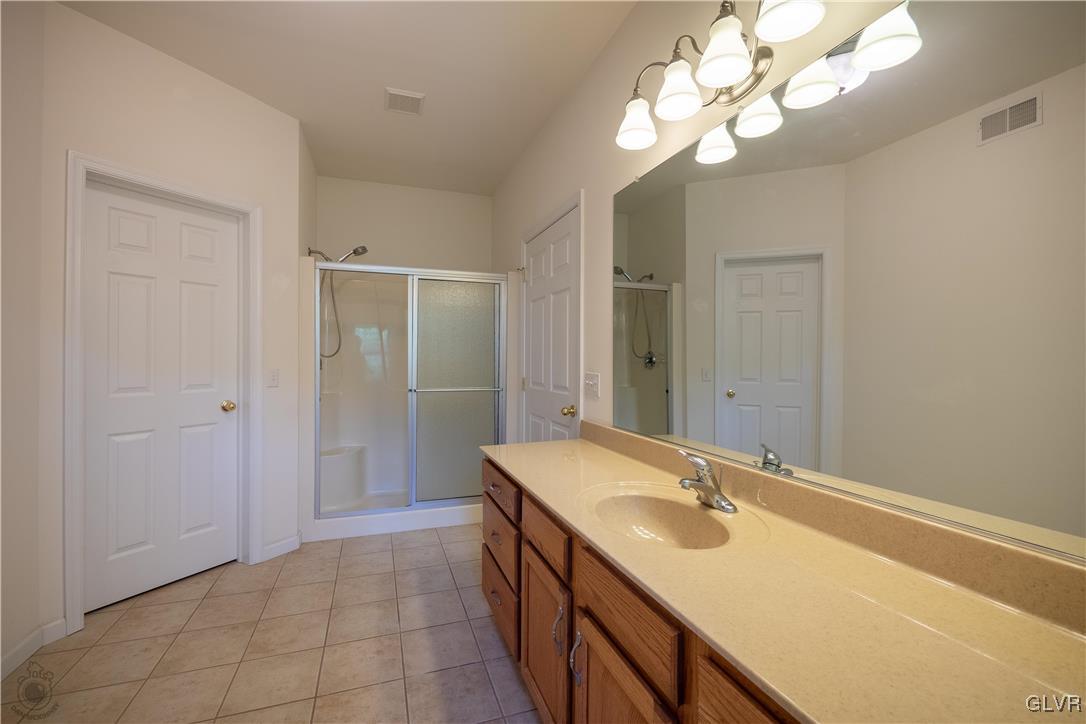 212 Bushkill Ridge Road Wind Gap, PA 18091 - Photo 22 of 36 a bathroom with a sink a vanity and a mirror
