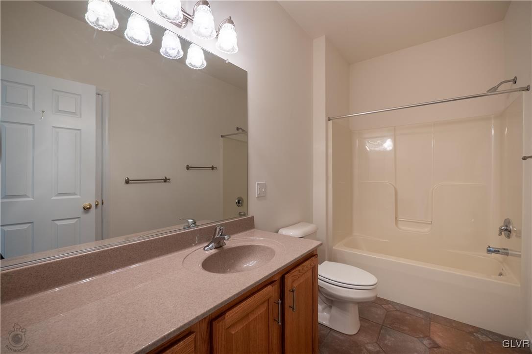 212 Bushkill Ridge Road Wind Gap, PA 18091 - Photo 24 of 36 a bathroom with a sink a toilet and shower