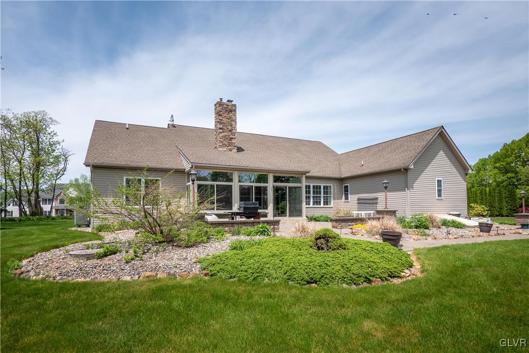 212 Bushkill Ridge Road Wind Gap, PA 18091 - Photo 27 of 36 a front view of house with a garden and patio