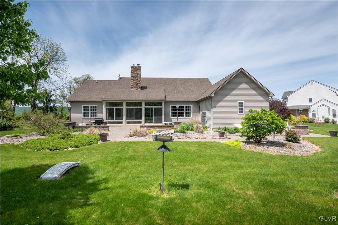 212 Bushkill Ridge Road Wind Gap, PA 18091 - Photo 28 of 36 a front view of a house with yard patio and green space