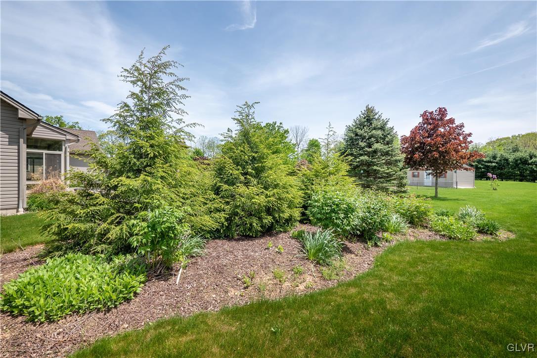 212 Bushkill Ridge Road Wind Gap, PA 18091 - Photo 29 of 36 a backyard of a house with lots of green space and garden view