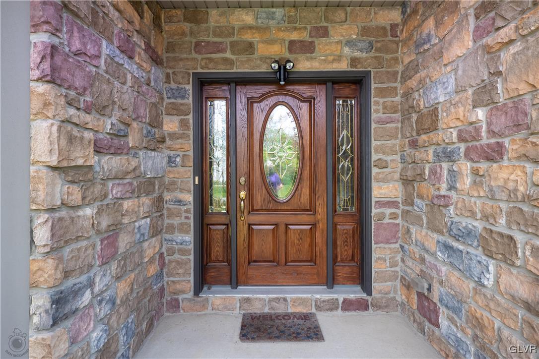 212 Bushkill Ridge Road Wind Gap, PA 18091 - Photo 4 of 36 a front view of a house with entryway