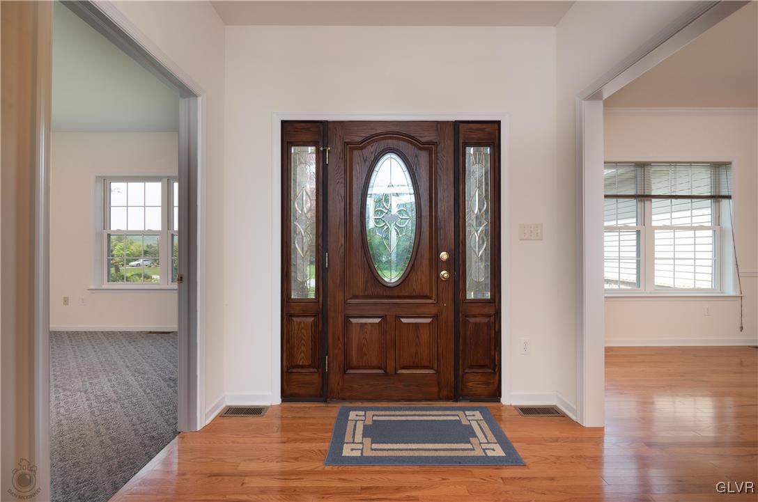 212 Bushkill Ridge Road Wind Gap, PA 18091 - Photo 5 of 36 a view of a door windows and bathroom with wooden floor